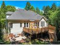 Spacious back deck perfect for entertaining, complemented by a serene outdoor lounge area at 2709 Penfold Ln, Wake Forest, NC 27587
