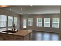 Bright, open-concept living area with hardwood floors and an abundance of natural light at 3112 Star Gazing Ln, Durham, NC 27703