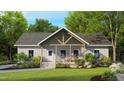 Inviting home featuring a charming front porch and manicured lawn, offering a warm welcome at 3188 Williams Ln, Graham, NC 27253