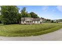 Inviting one-story home with a well-manicured lawn, charming front porch and a two-car garage at 422 River Ridge Ln, Timberlake, NC 27583