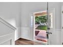 Bright entryway with wood floors showcases the front door and exterior view at 522 Crossview Ln, Durham, NC 27703