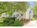 Charming home featuring a landscaped front yard and inviting entry at 669 Tyler Run Dr, Wake Forest, NC 27587