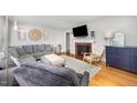 Cozy living room with fireplace, hardwood floors, and comfortable seating at 903 S 2Nd St, Smithfield, NC 27577