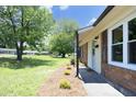 The home features a well-manicured lawn, tasteful landscaping, and a welcoming entrance at 1422 Duggins Dr, Burlington, NC 27217