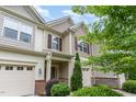 Charming townhouse with well-kept landscaping and a welcoming entrance and one-car garage at 172 Token House Rd, Durham, NC 27703