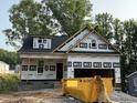 New construction featuring a brick foundation and a spacious two-car garage at 218 Oakdale Ave, Clayton, NC 27520
