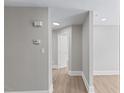 Light-filled hallway showcasing the home's neutral palette and elegant, modern flooring at 2201 Mountain Mist Ct # 202, Raleigh, NC 27603