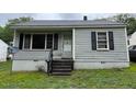 Quaint single-story home featuring horizontal siding and an inviting front entrance at 246 Keene St, Henderson, NC 27536