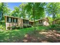 Exterior shot of home with mature trees on a well-maintained lawn at 3216 Green Valley Dr, Sanford, NC 27330