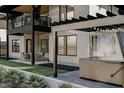 Outdoor living space with a hot tub, covered patio, and modern architectural details at 3801 Peaceful Creek Trl, Zebulon, NC 27597