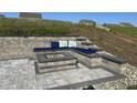 Cozy outdoor stone patio includes built in seating, fire pit, and rock landscaping at 400 Access Dr, Youngsville, NC 27596
