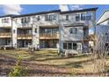 View of a home with a backyard, patio, and a wooded area in the background at 4607 Mint Leaf Ln, Raleigh, NC 27612