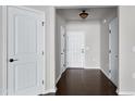 Bright foyer with hardwood floors, white doors, and neutral paint creates a welcoming entrance at 628 Denhoff Dr, Cary, NC 27519