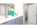 Bright bathroom with dual sinks, a large mirror, and elegant fixtures, offering a spa-like experience at 6445 Granite Quarry Dr, Raleigh, NC 27610