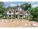 Beautiful two-story home with classic design, manicured shrubs, and well-maintained lawn at 90021 Hoey, Chapel Hill, NC 27517