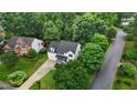 An aerial view shows the home's location in a verdant, tree-lined neighborhood with mature landscaping at 100 Citrus Pl, Cary, NC 27519