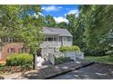 Charming condo with wood bridges leading to a covered porch entry and second story balcony at 101 Oyster Bay Ct # B2, Cary, NC 27513
