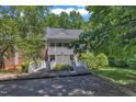 Charming condo with wood bridges leading to a covered porch entry and second story balcony at 101 Oyster Bay Ct # B2, Cary, NC 27513