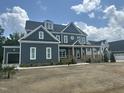 Beautiful two-story home with a front porch and a two-car garage, on a partially landscaped yard, located in a nice community at 1017 Azalea Garden Cir, Raleigh, NC 27603