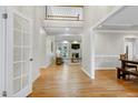 Inviting foyer with hardwood flooring, high ceilings, and views into the living and dining areas at 108 Ellsworth Pl, Chapel Hill, NC 27516