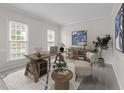 Bright office space with rustic wooden desk, chair, and built-in shelving at 12325 Amoretto Way, Raleigh, NC 27613