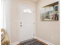 Inviting entryway featuring a white door and tasteful decor at 1290 Pyrtle Dr, Graham, NC 27253