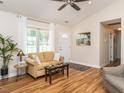 Bright living room with modern decor, wood floors, and lots of natural light at 1290 Pyrtle Dr, Graham, NC 27253