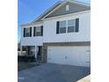 Two-story home with white siding, a two-car garage, and a paved driveway at 132 Rockfall Way, Rocky Mount, NC 27803