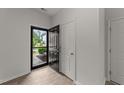 Bright foyer with modern flooring, white trim, and a welcoming entry door at 19 Willow Green Dr, Clayton, NC 27527