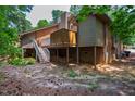 Spacious backyard with a deck and stairs, offering plenty of outdoor space at 200 W Woodcroft Pkwy # 52A, Durham, NC 27713