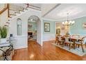 Open-concept dining area featuring hardwood floors and seamless flow to living room at 204 Middlestone Ct, Wake Forest, NC 27587