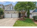 Inviting exterior with a charming entrance and a beautifully landscaped front yard at 2721 Cameron Pond Dr, Cary, NC 27519
