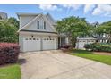 Lovely two-story home featuring a spacious driveway and well-maintained landscaping at 2721 Cameron Pond Dr, Cary, NC 27519