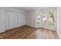 Bright bedroom with laminate flooring, a large closet, and a sunny bay window at 2821 Edridge Ct, Raleigh, NC 27612