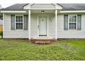 Up-close view of the home's entrance, showing the welcoming front door and brick-lined entryway at 308 Sandy Knob Ln, Rocky Mount, NC 27803