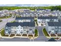 New townhome community with lush green spaces, modern architecture, and well-planned street layouts at 3101 Brellon Ln, Durham, NC 27703