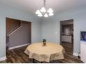 Cozy dining area with stylish flooring, leading to kitchen, perfect for Gathering meals and gatherings at 333 Bald Head Island Dr, Garner, NC 27529