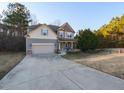 Inviting two-story home showcasing a spacious driveway, attached garage, and classic architecture at 333 Bald Head Island Dr, Garner, NC 27529