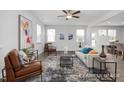 Bright living room boasts stylish furnishings, ample natural light, and modern decor at 428 Longleaf Glen Lane, Zebulon, NC 27597