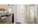 Welcoming living room with hardwood floors, a cozy couch, and stylish decor at 4508 Cobble Creek Ln, Raleigh, NC 27616