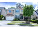 Charming two-story home with a well manicured lawn and beautiful curb appeal at 5016 Trembath Ln, Cary, NC 27519