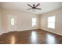 Bright living room with hardwood floors and ceiling fan at 6 1St St, Franklinton, NC 27525