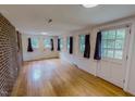 Spacious living room with hardwood floors, natural light, and neutral paint color at 623 Chambers Rd, Rougemont, NC 27572
