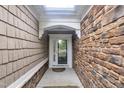 Stylish entrance features stone and wood siding, a skylight, and a secure front door at 804 Harsworth Dr, Cary, NC 27519
