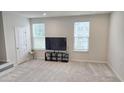 Bedroom with soft carpet and two windows for natural light at 904 Romeria Dr, Durham, NC 27713