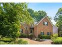 Beautiful brick home featuring manicured landscaping and a welcoming entrance at 1025 Kingsway Dr, Apex, NC 27502