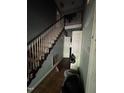 Hallway featuring hardwood floors, staircase, and natural light at 1036 Altice Dr, Raleigh, NC 27603