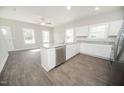 Modern kitchen with white cabinets, stainless steel appliances, and a center island at 105 Ambergate Ct, Rocky Mount, NC 27804