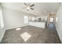Bright, open-concept living area with wood floors that flows into a modern kitchen at 105 Ambergate Ct, Rocky Mount, NC 27804