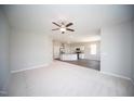 Open-concept living area flows into a modern kitchen with granite countertops and stainless steel appliances at 109 Ambergate Ct, Rocky Mount, NC 27804